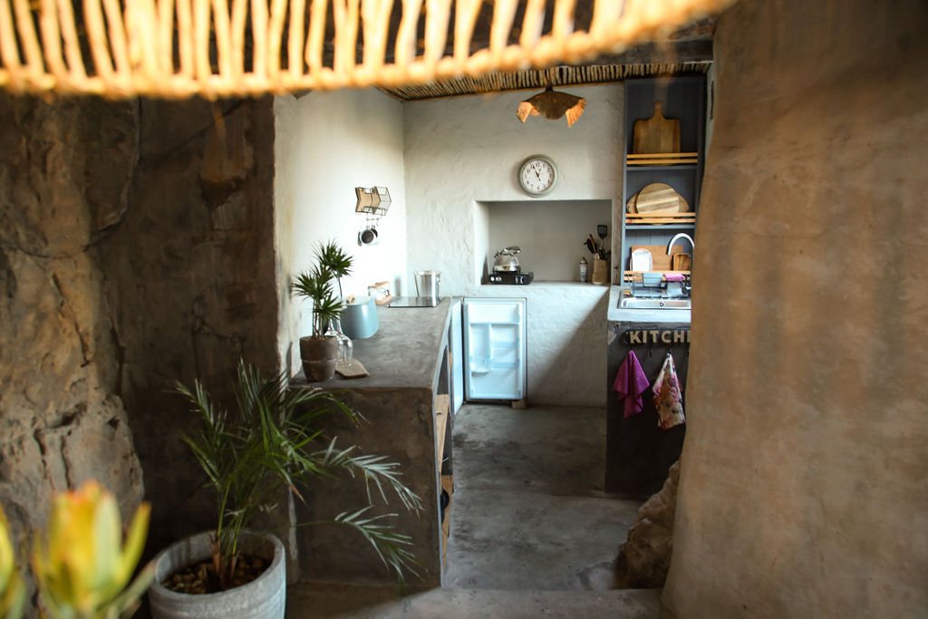 Compact kitchenette inside a Donkieskraal cave chalet