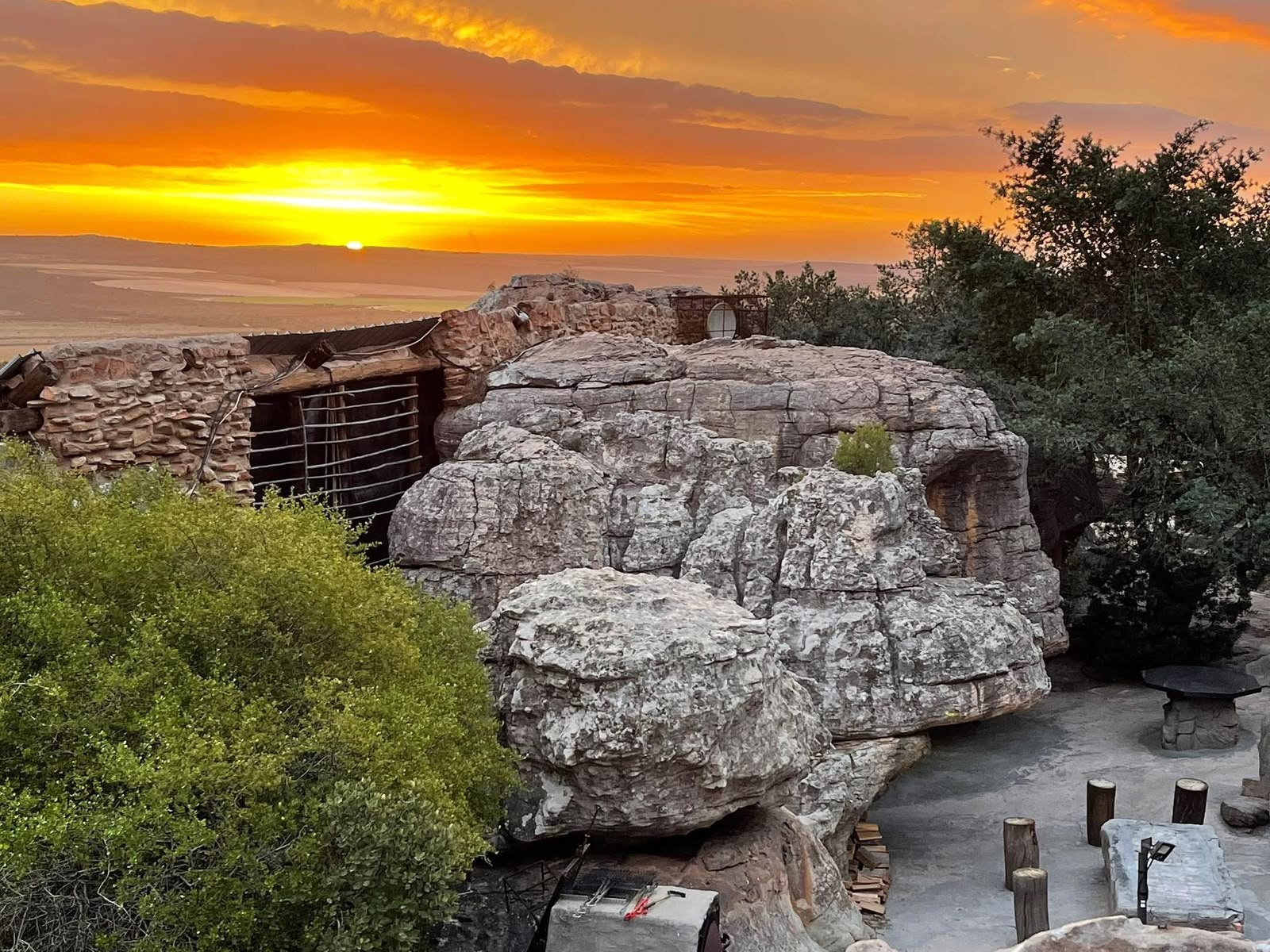 Donkieskraal cave chalet and natural rock formations beneath the sunset