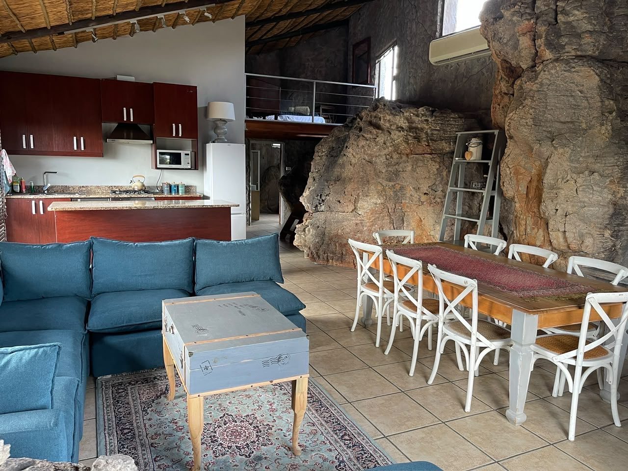 Hendre's House rock interior with kitchen, dining and lounge areas at Donkieskraal