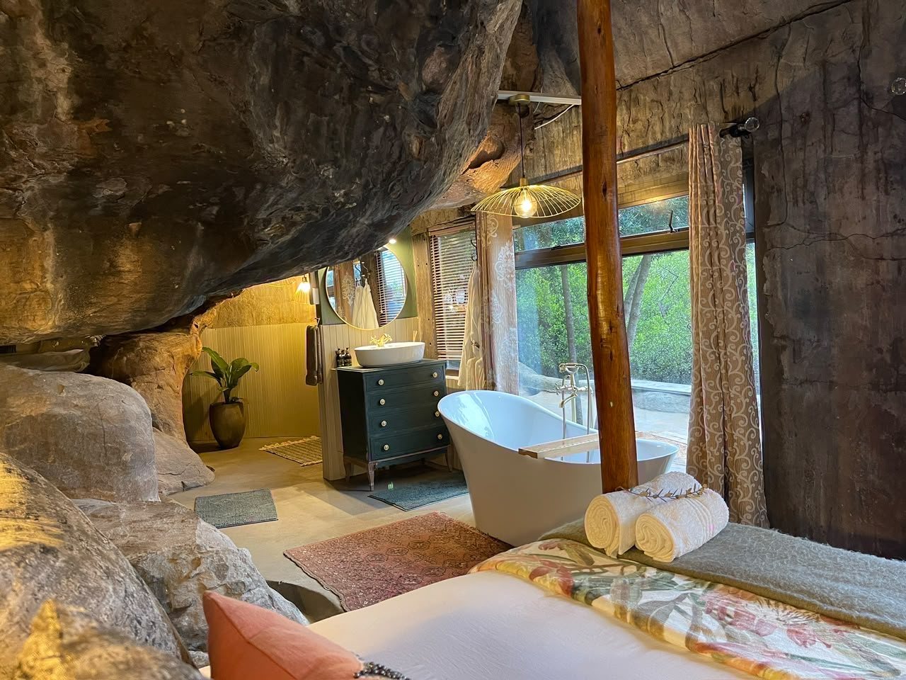 Romantic cave chalet interior with natural stone walls