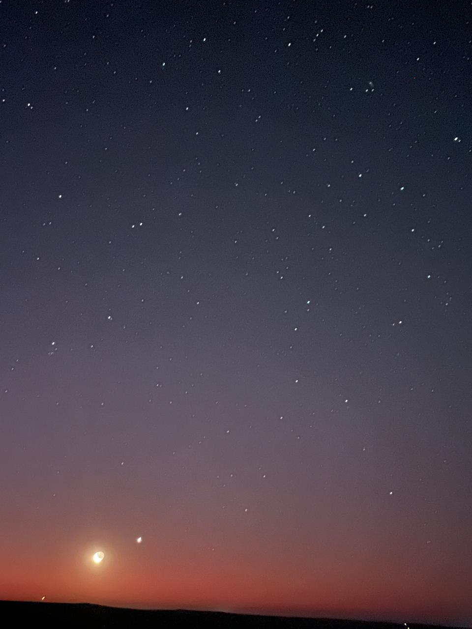 Crescent moon and stars above a red twilight horizon at Donkieskraal